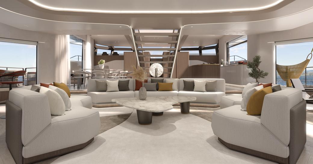 Main salon onboard Extra Yachts VILLA X30. White seating surrounds low down coffee table, with panoramic windows around circumference.