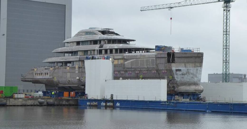 Lurssen superyacht Ace 21 emerging from shed at Bremerhaven facility.