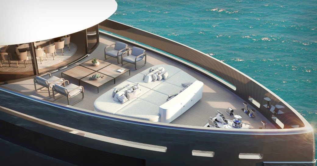 Overview of bow onboard Benetti B.YOND 37m. Central sun pads surrounded by comfortable seating and views of the sea.