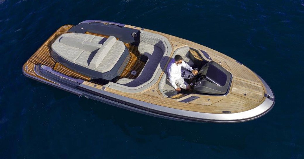 Evo T2 Tender on calm sea with man at helm