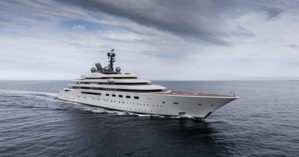 Superyacht B:UE underway, surrounded by sea.