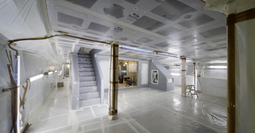 Interior space onboard Tankoa S501 under construction, staircase on left with empty white space in protective film.