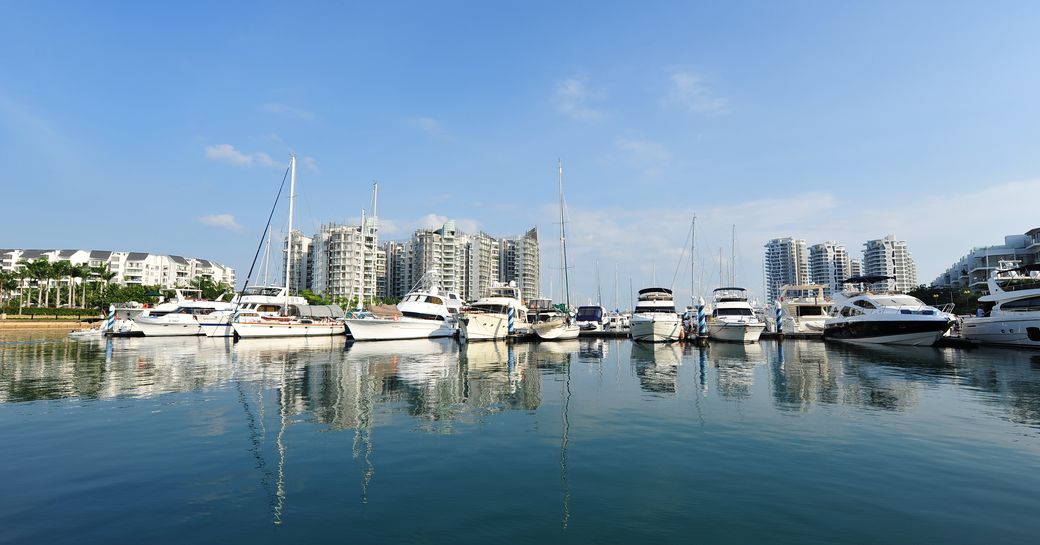 One 15 Marina Sentosa Cove overview. Multiple motor yachts berthed.