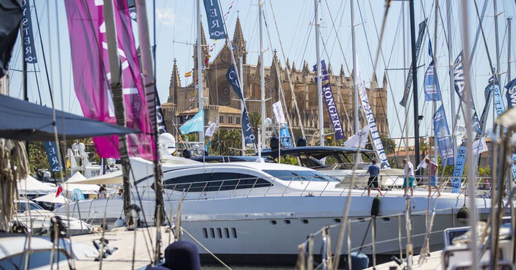 Marina Moll Vell in Palma, with superyacht berthed, surrounded by sailing boats.