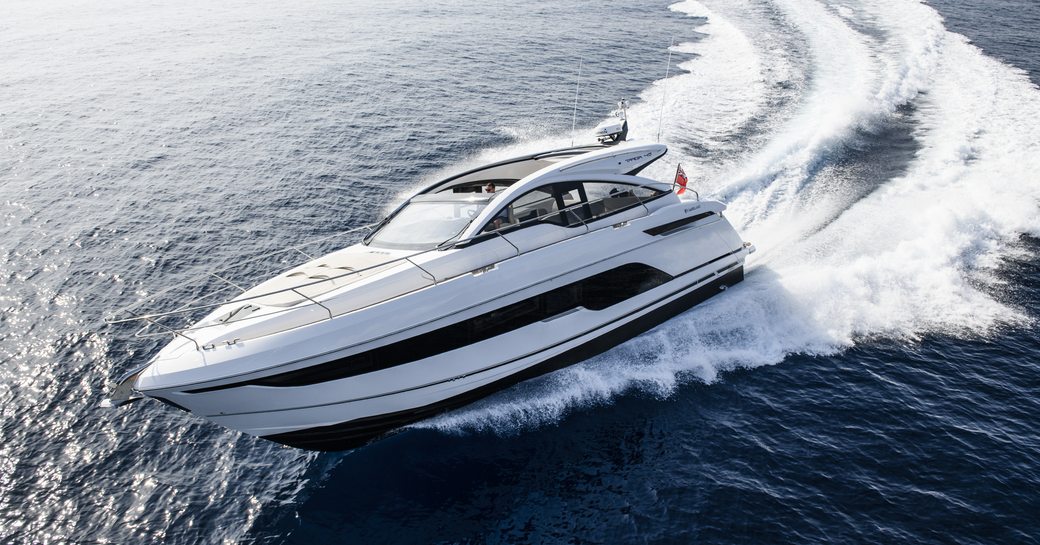 Targa 45 with white exterior and black glazing cuts through the water 