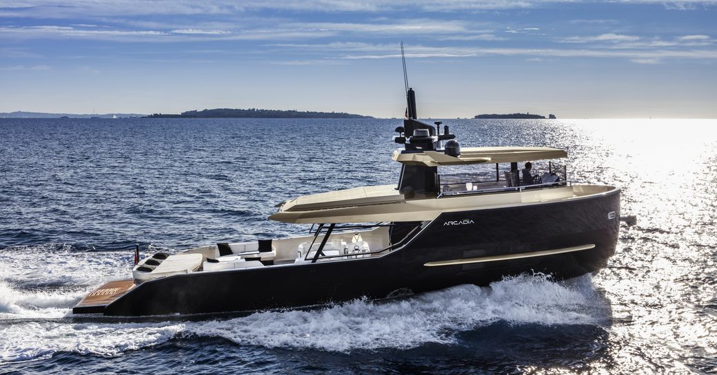 Arcadia Sherpa on sea, with spray emanating and clear sky in background