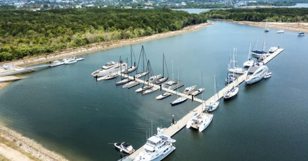 Elevated view of pontoon at Port Takola, Thailand, surrounded by foliage and sea