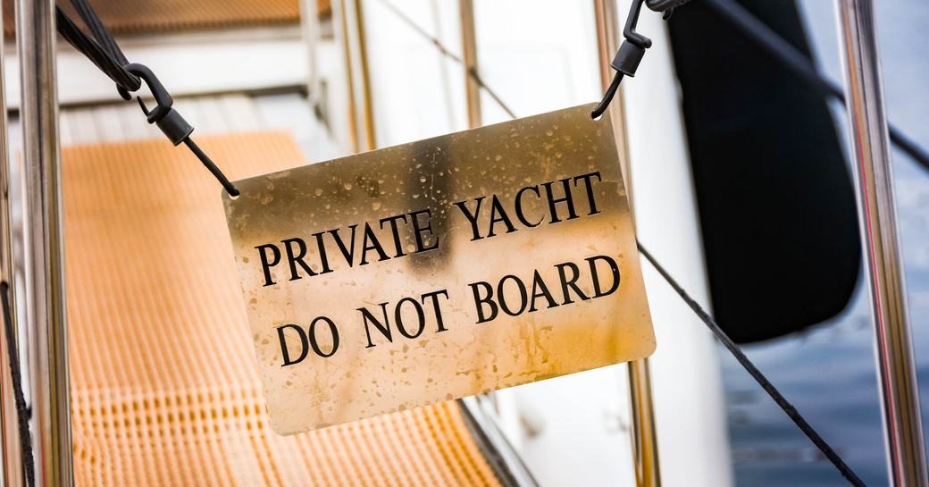 "Do not board" notice on the gangway of a luxury private yacht in Cannes harbour