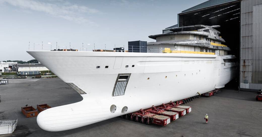 Close up view of bulbous bow on the Oceanco Project Y722 megayacht, sat on tarmac in front of construction shed