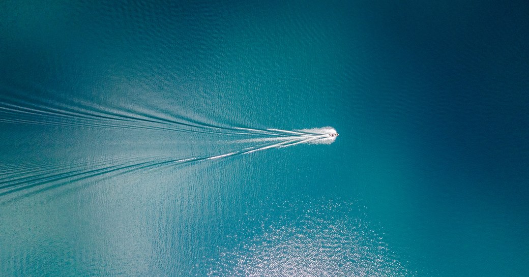 aerial view of yacht offshore on passage to international waters