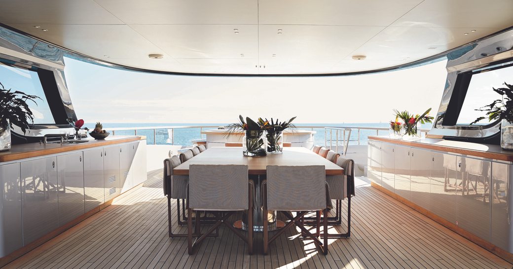 The central dining table beneath the sundeck hardtop
