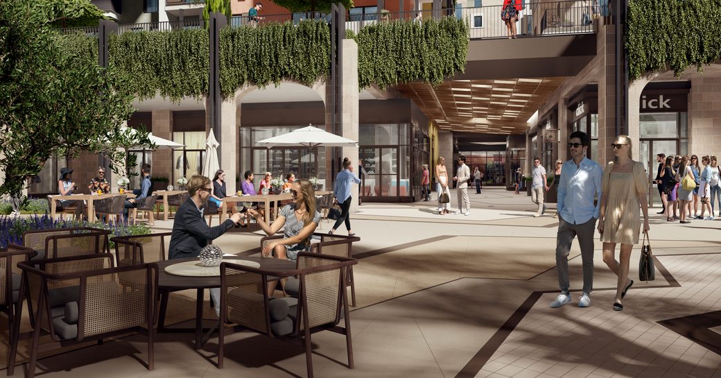 Shopping precinct in Boka Place, Porto Montenegro development. People sat at tables with drinks and others walking around window shopping.