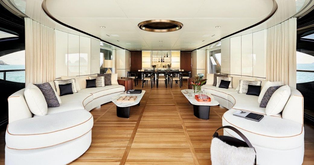 Lounge area on Benetti Oasis 40M with lightly colored sofas