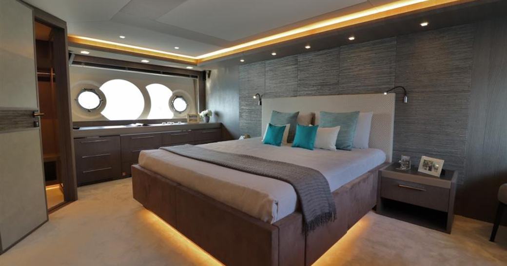 master suite on yacht in the mcy 86 series, with distinctive portholes by monte carlo yachts 