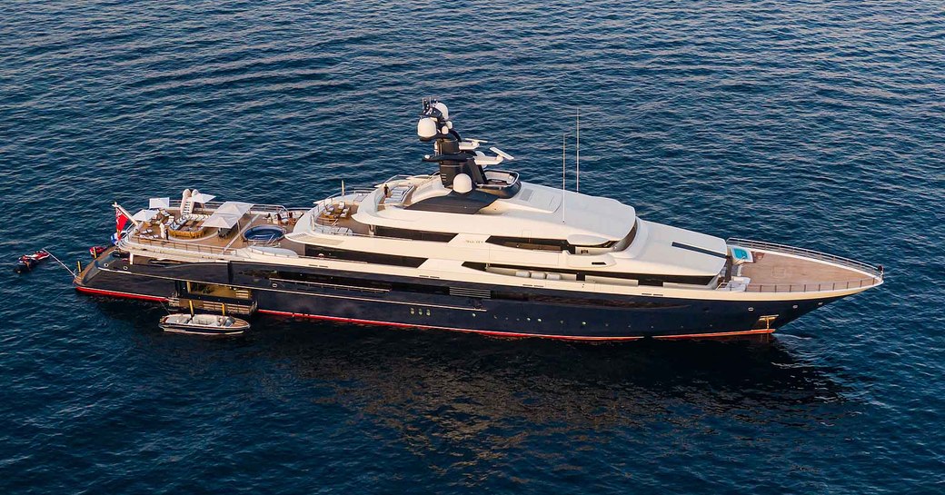 Aerial view of Superyacht TRANQUILITY underway, surrounded by sea.