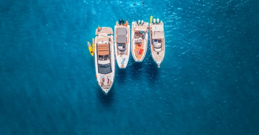 yachts rafted up on anchor