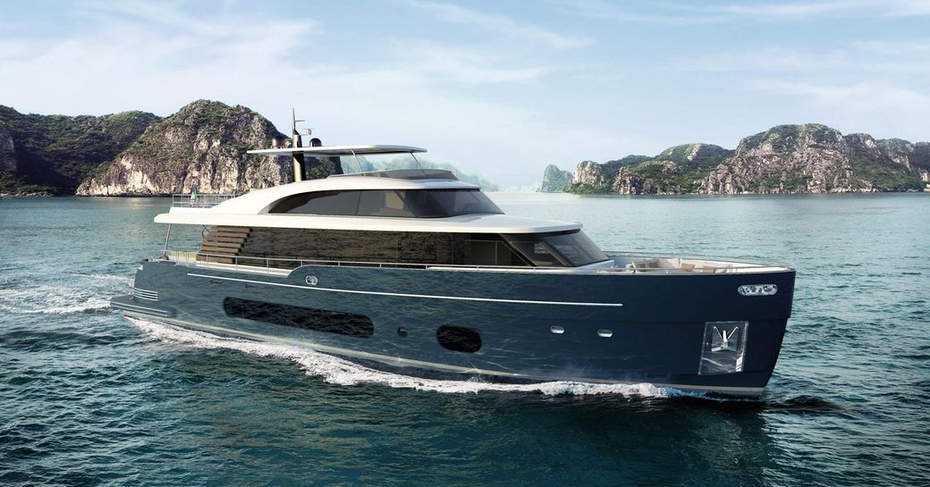 Azimut Magellano 25 Metri underway, surrounded by sea and rock formations in background