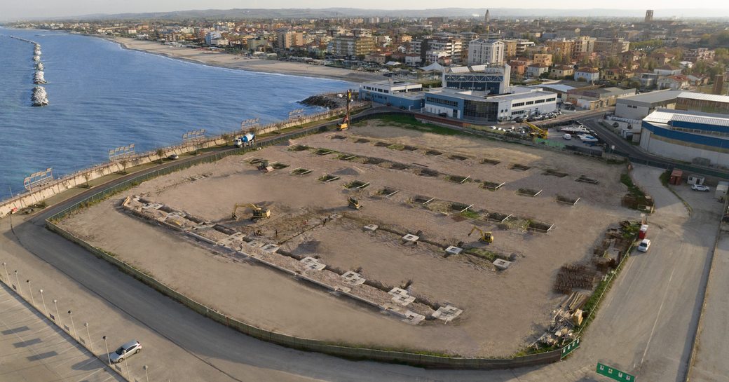 Aerial view of new in build Wider Yachts facility in Fano, with sea in background.