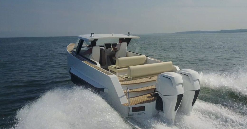 Iguana Commuter tender on water