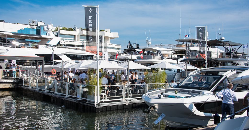 Display of motor yachts at the Cannes Yachting Festival with Prestige flags