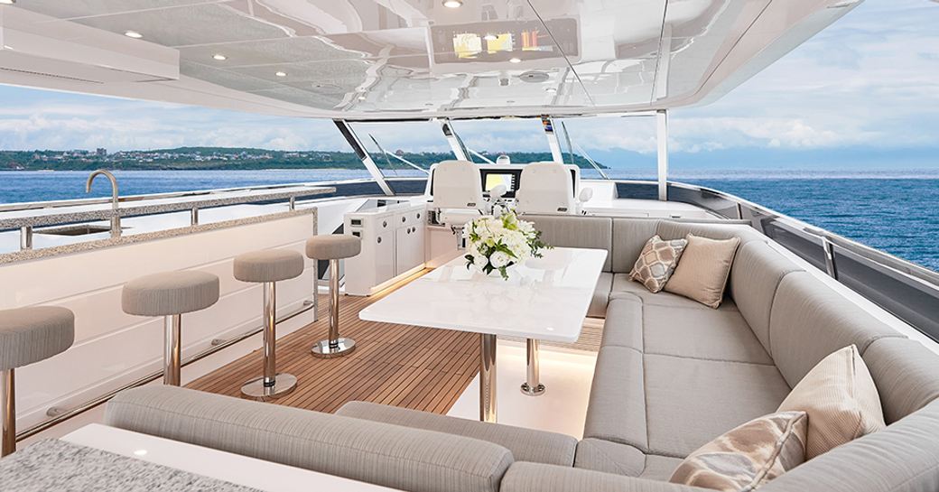 Bridge deck on E81 with large sofa, wet bar and table