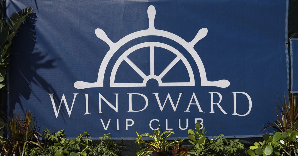 Windward VIP sign at Palm Beach International Boat Show. Surrounded by foliage.