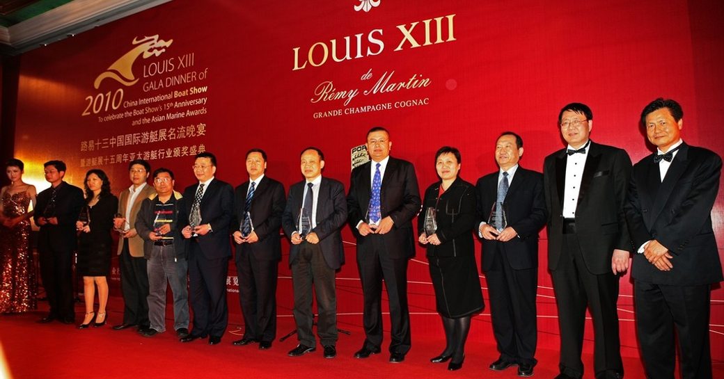 Line of award winners on stage at Asian Marine & Boating Awards in 2010