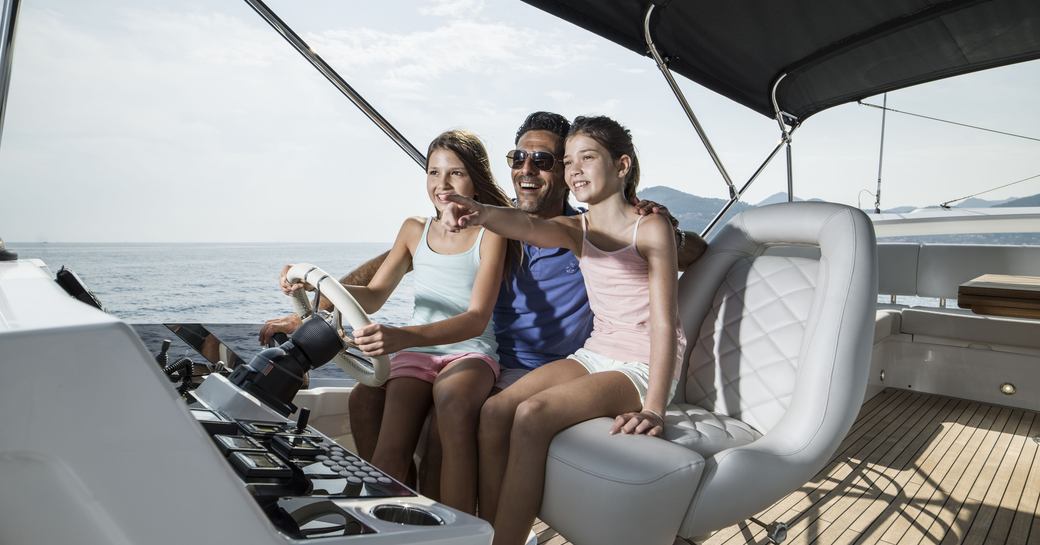 Family driving a boat 