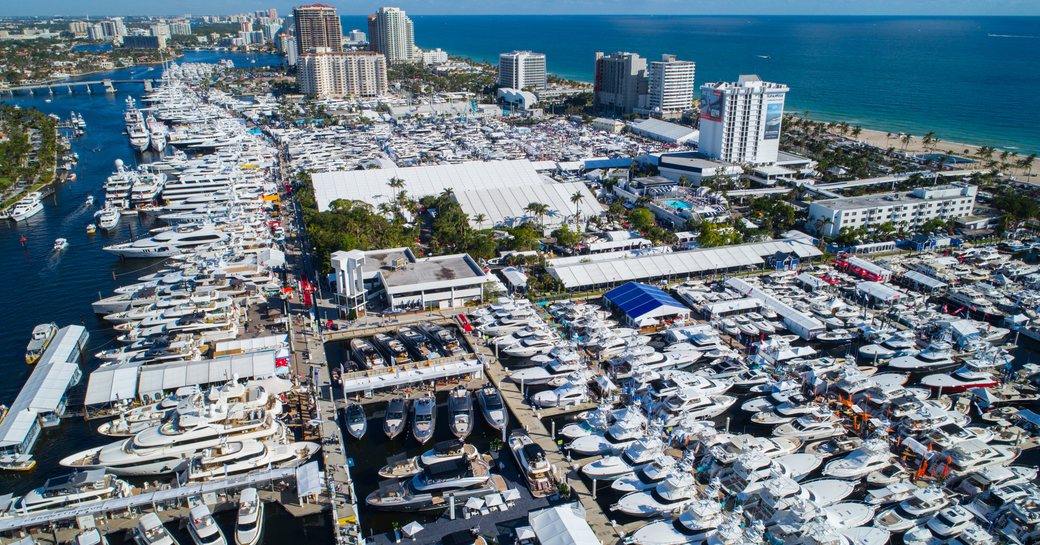 Aerial view of FLIBS, hundreds of anchored yachts surrounded by towering buildings and sea