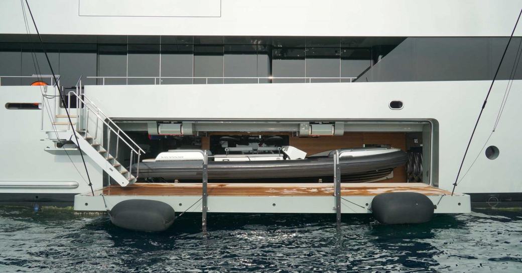 Tender in superyacht tender garage with platform down