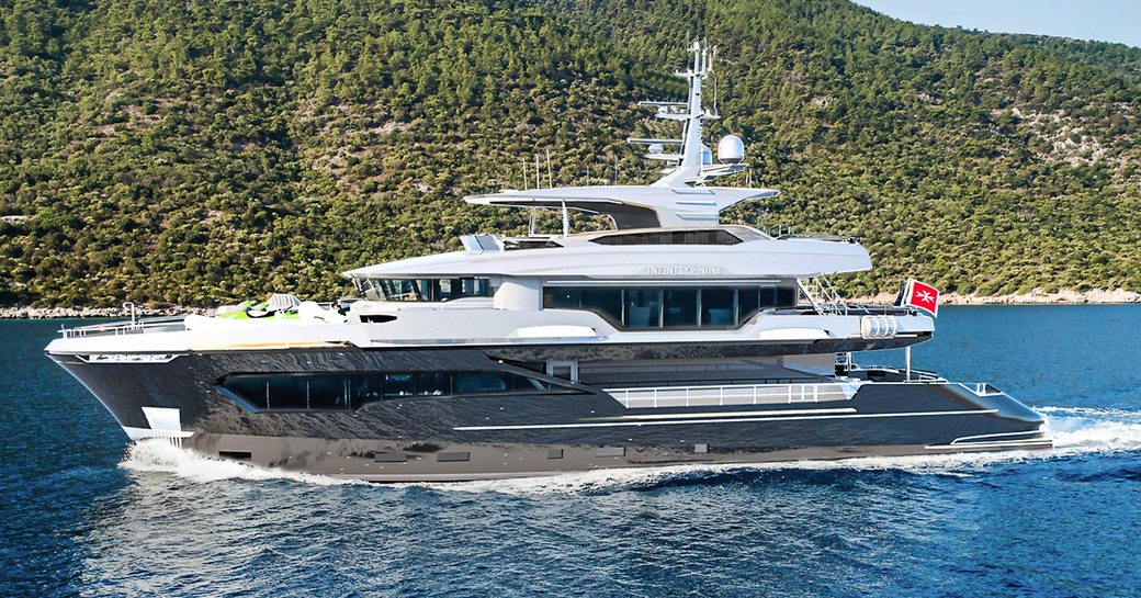 M/Y Infinity Nine underway, passing elevated green terrain