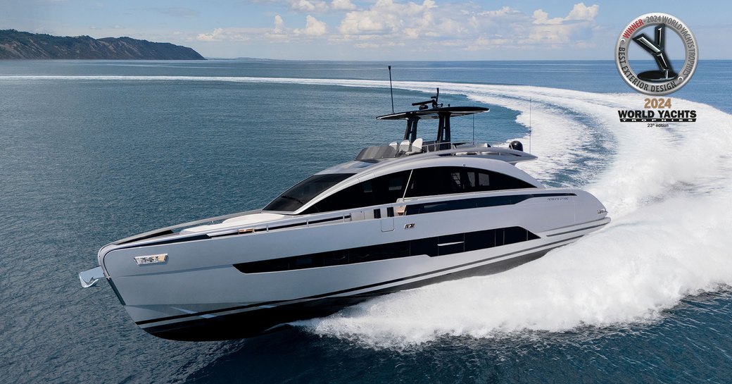 A port-side view of the Pershing GTX80 in silver carving a wide turn at sea