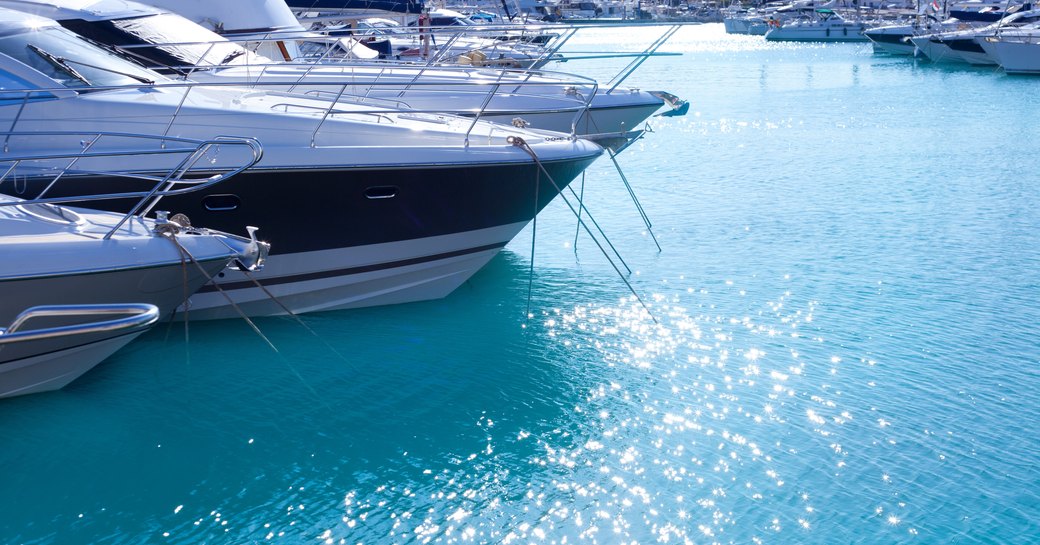 small motor yacht bows in marina