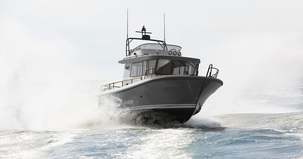 Targa 41 motor boat running shot on grey but bright day, starboard bow aspect