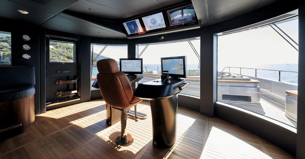 Wheelhouse on Benetti Oasis 40M showing helm and view outside