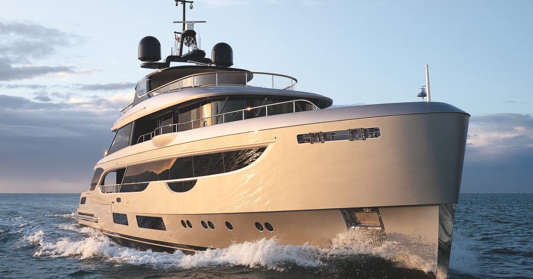 Benetti OASIS 40M shot taken from water level towards starboard bow, running shot, bright day, yacht creating a little wake