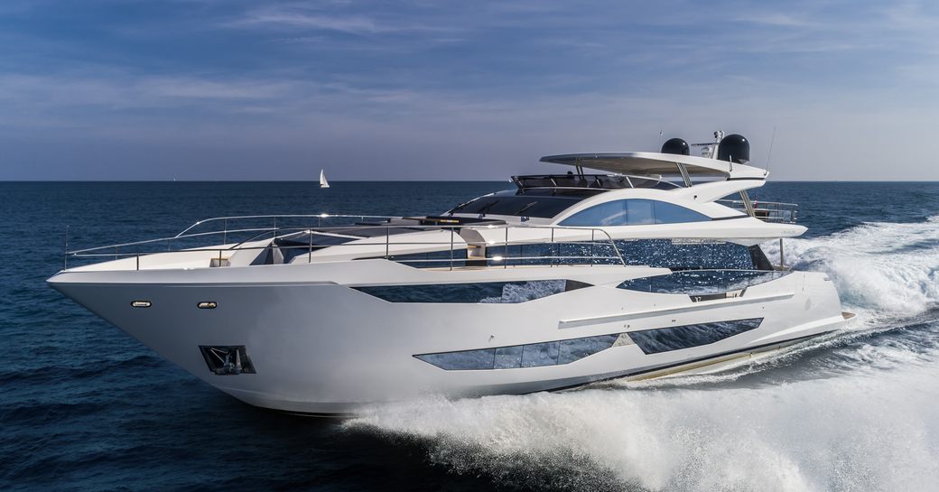 Pearl 95 superyacht on sea with clear sky behind being driven at speed