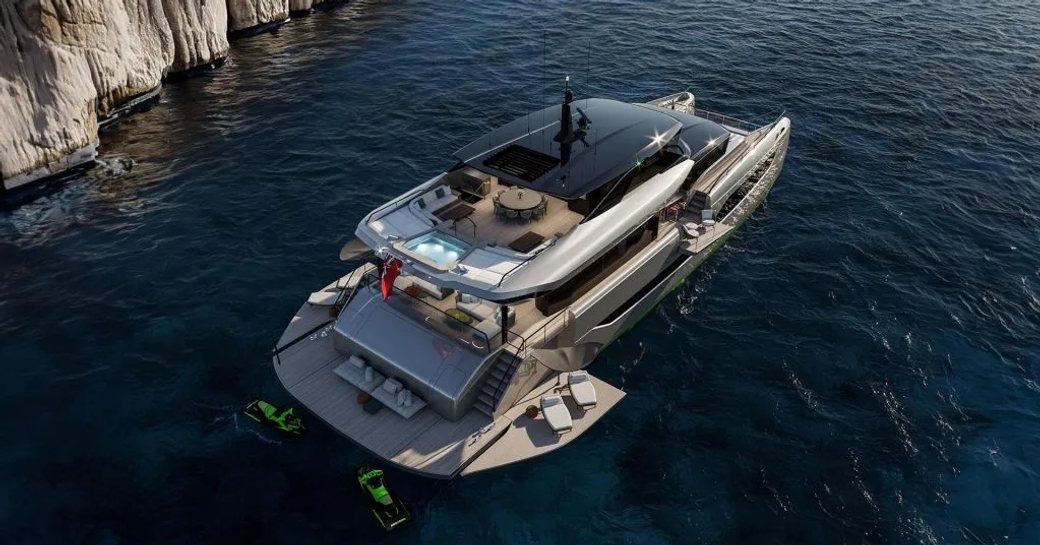 Sunreef Ultima 111 aerial shot over starboard aft deck and side profile, yacht on anchor in calm water, side wings extended and personal watercraft in the water