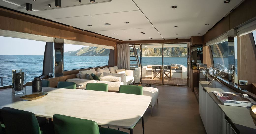 Salon with tables and chairs visible on Ferretti Yachts 780