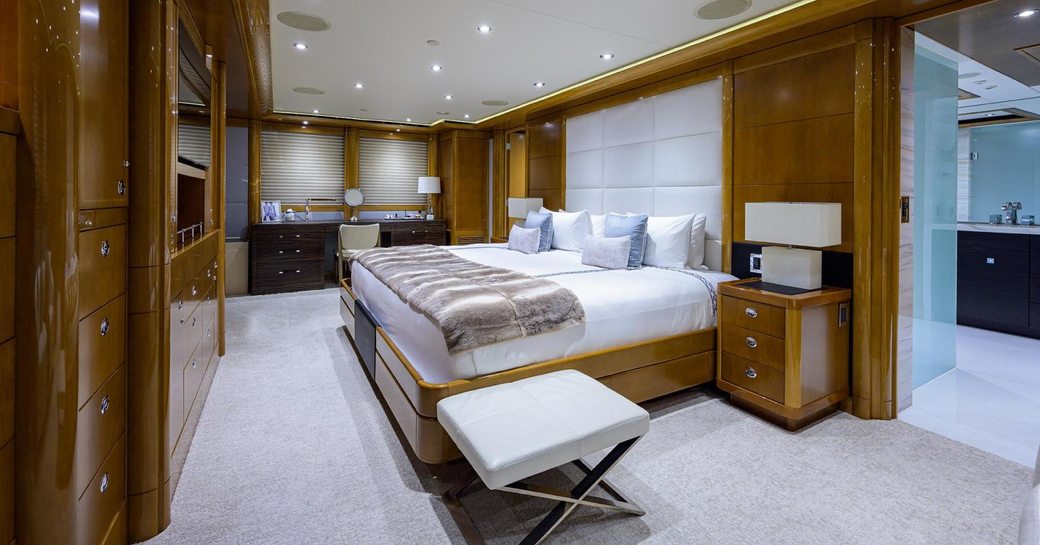 Master cabin onboard Quantum of Solace, central berth facing port with flatscreen TV directly in front.