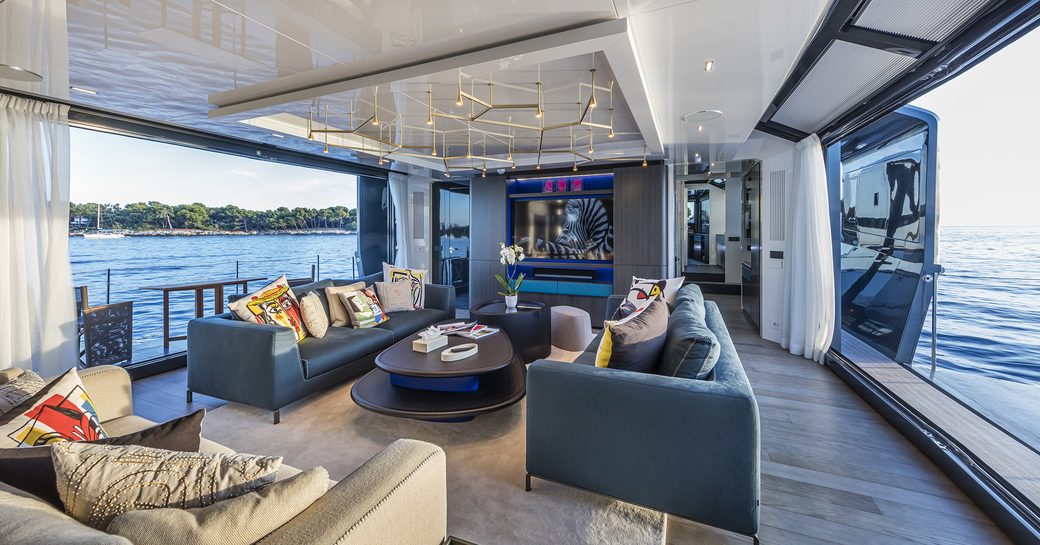 Three sofas and coffee table on main salon area of Sea Coral II