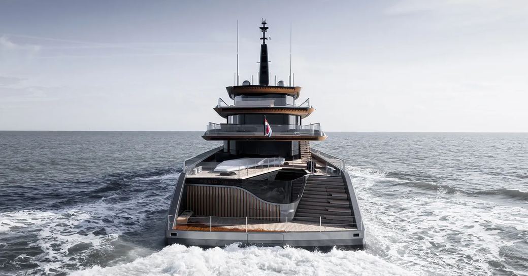 Aft view of superyacht OBSIDIAN at sea.