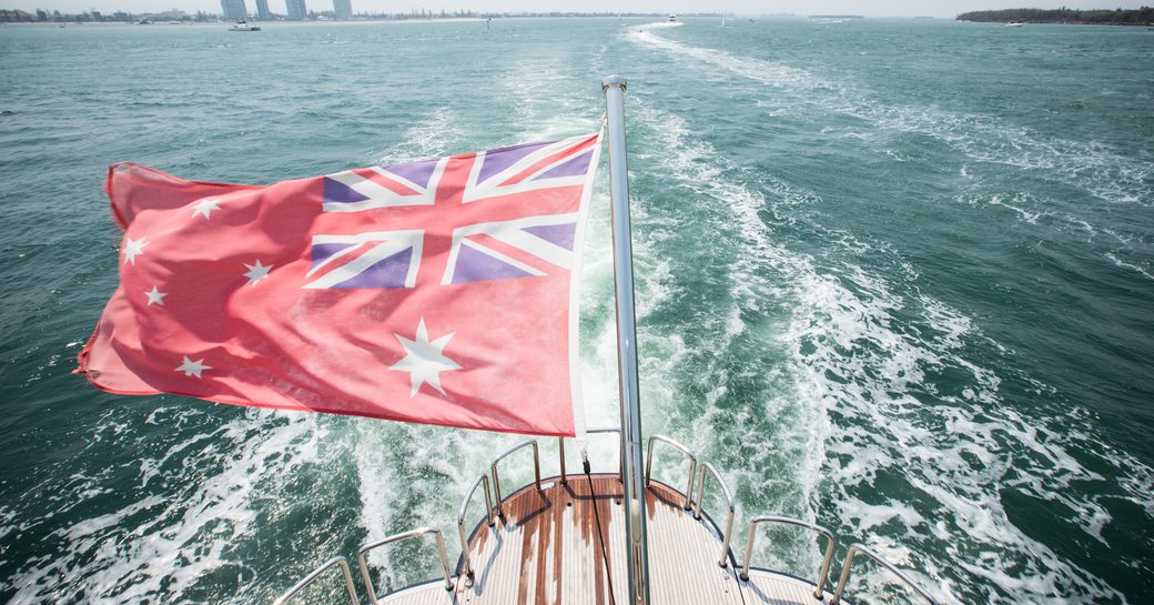 Superyacht 'Patriot I' with the Australian Red Ensign flag as the foreground image.