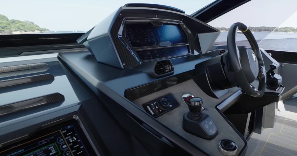 The Tecnomar Lamborghini 63 helm console utilizes parts straight from the manufacturer's supercars including the steering wheel and screens