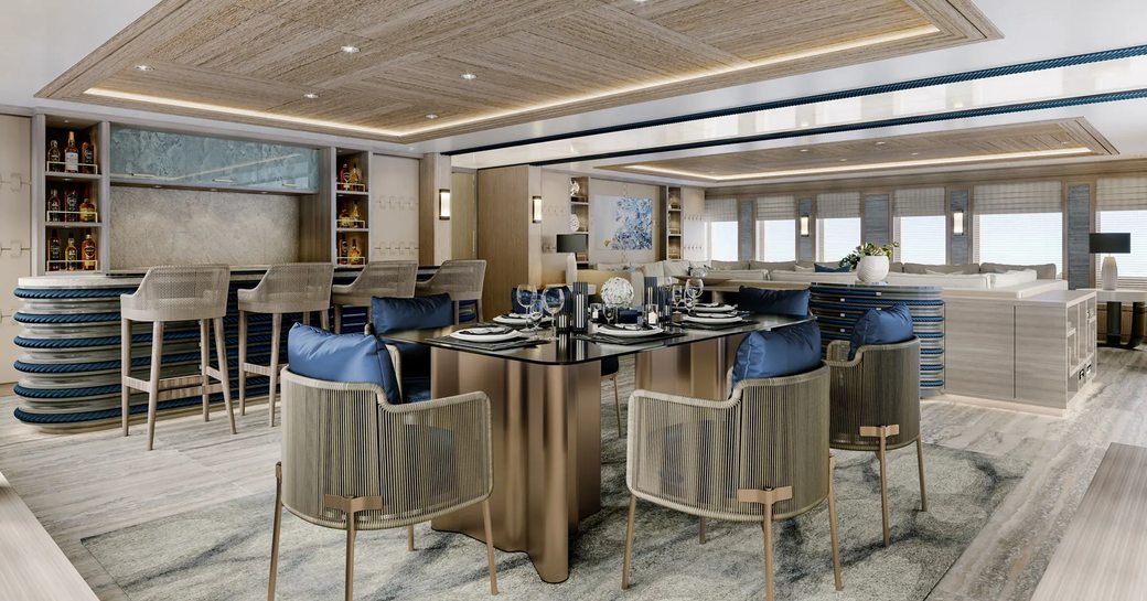 Chairs around table in interior of explorer yacht VICTORIOUS