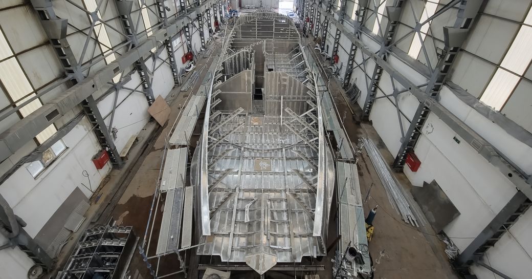 A wide angle photo of a GX42 currently under construction, showcasing its metal superstructure