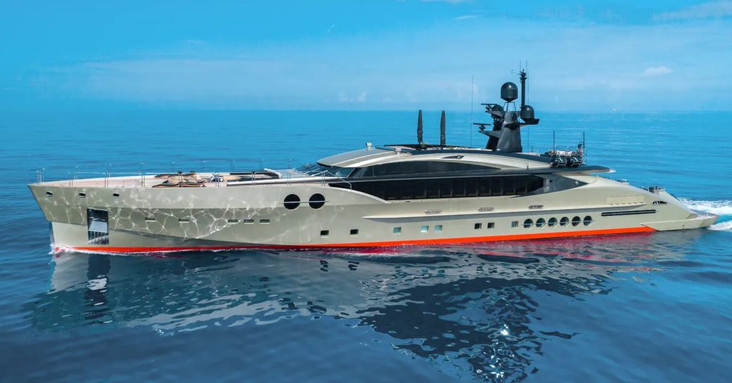 Sideview of DB9 superyacht underway, surrounded by sea.