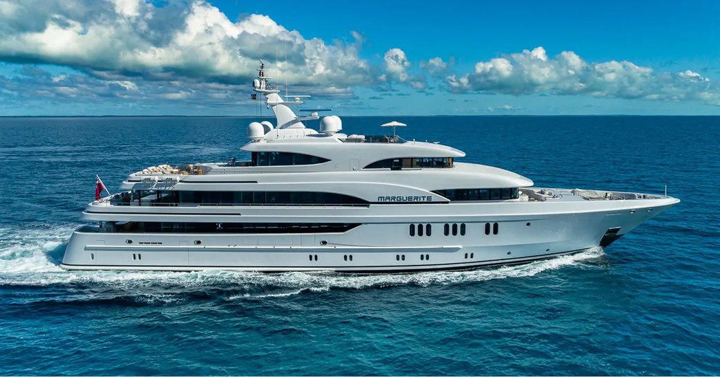 Side view of superyacht Marguerite underway, surrounded by sea.