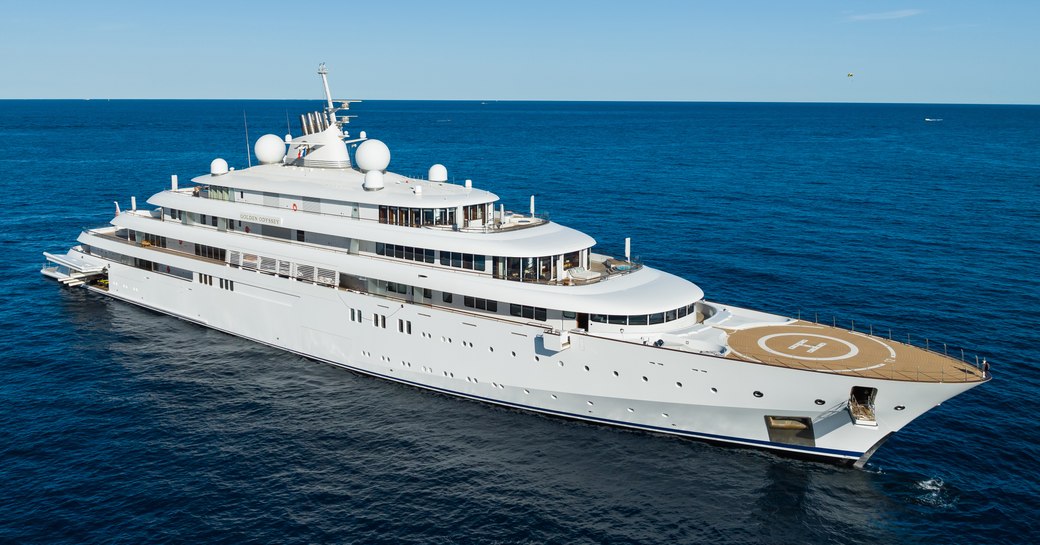 Lurssen's GOLDEN ODYSSEY at anchor in a calm blue sea