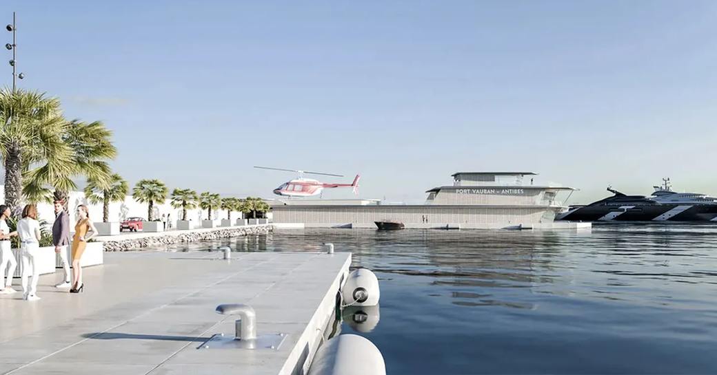 Overview of helipad at Port Vauban with helicopter moving in to land.